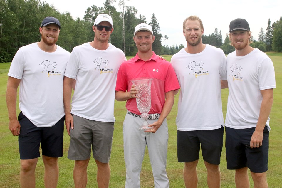 Ben Griffin poses with the Staal brothers after capturing the Staal Foundation Open on Sunday, July 15, 2018 at Whitewater Golf Club. (Leith Dunick, tbnewswatch.com)