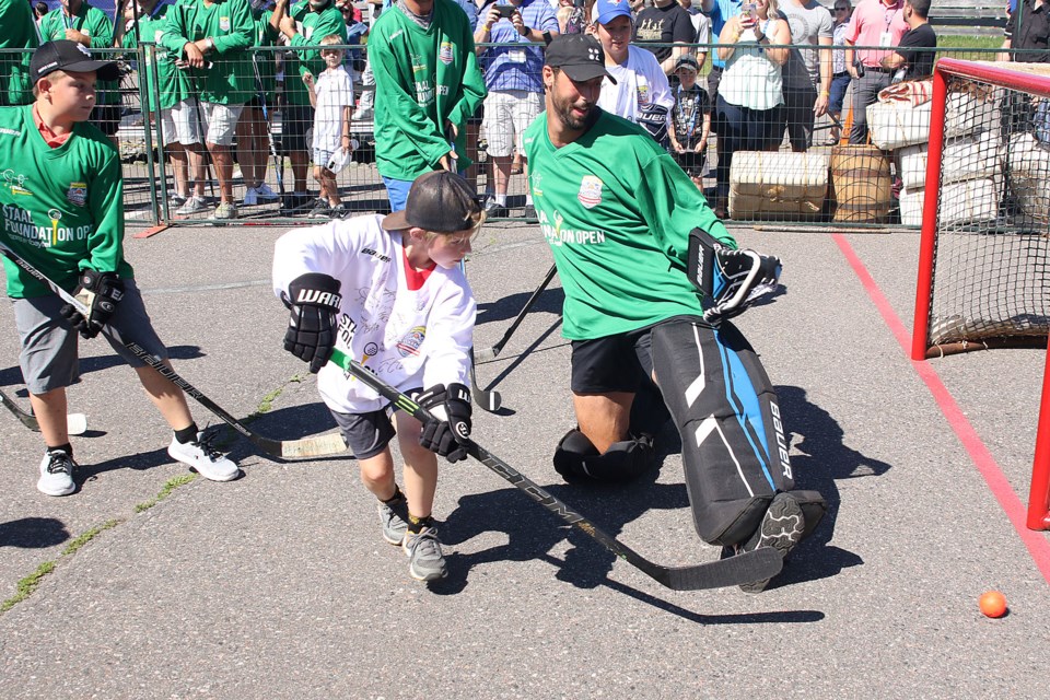 St. Louis Blues defenceman, an emergency fill-in in net, makes a stop on Monday, July 9, 2018 at the Fountain Tire Summer Hockey Classic at White Water Golf Club. (Leith Dunick, tbnewswatch.com)