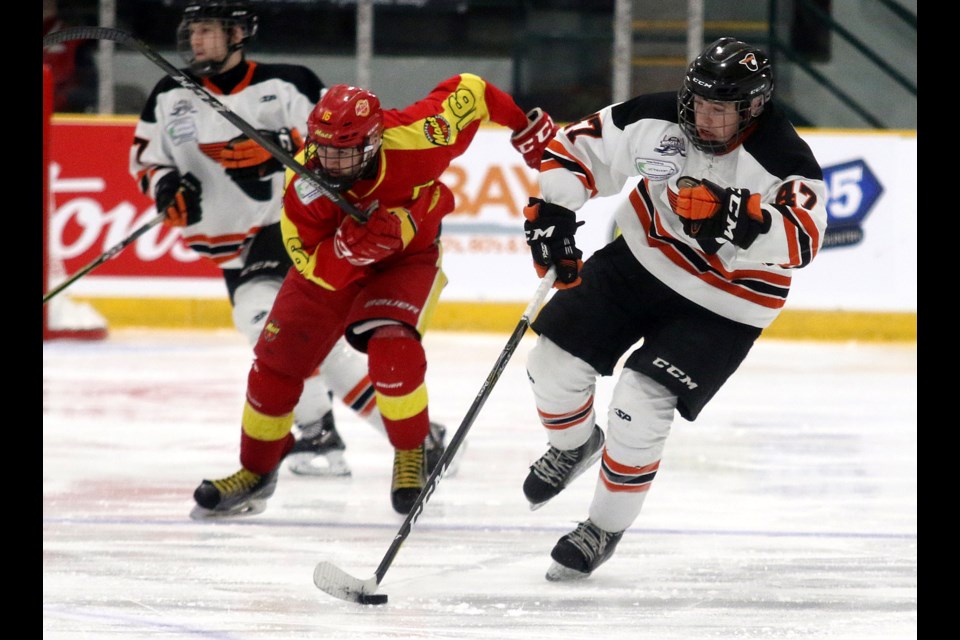 Magog's Alexandre Doucet (right) and Halifax's Ian Watt each scored on Tuesday, April 23, 2019 at the TELUS Cup at Fort William Gardens. (Leith Dunick, tbnewswatch.com)