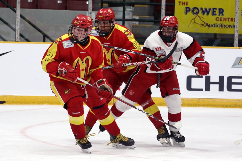 Halifax's Hunter Benoit (7) and Zach Byard battle Toronto's Thomas Harbour in the opening game of the 2019 TELUS Cup on Monday, April 22, 2019 at Fort William Gardens. (Leith Dunick, tbnewswatch.com)