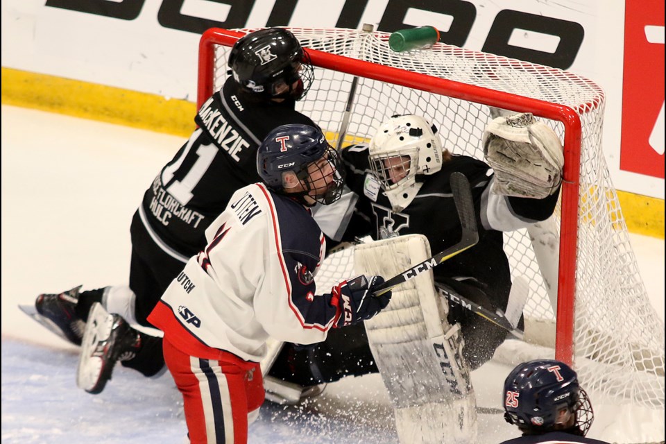 Thunder Bay Kings goalie Eric Vanska is bowled into the net, teammate Cole MacKenie and Tisdale's Liam Rutten jockey for position on Tuesday, April 23, 2019. (Leith Dunick, tbnewswatch.com)