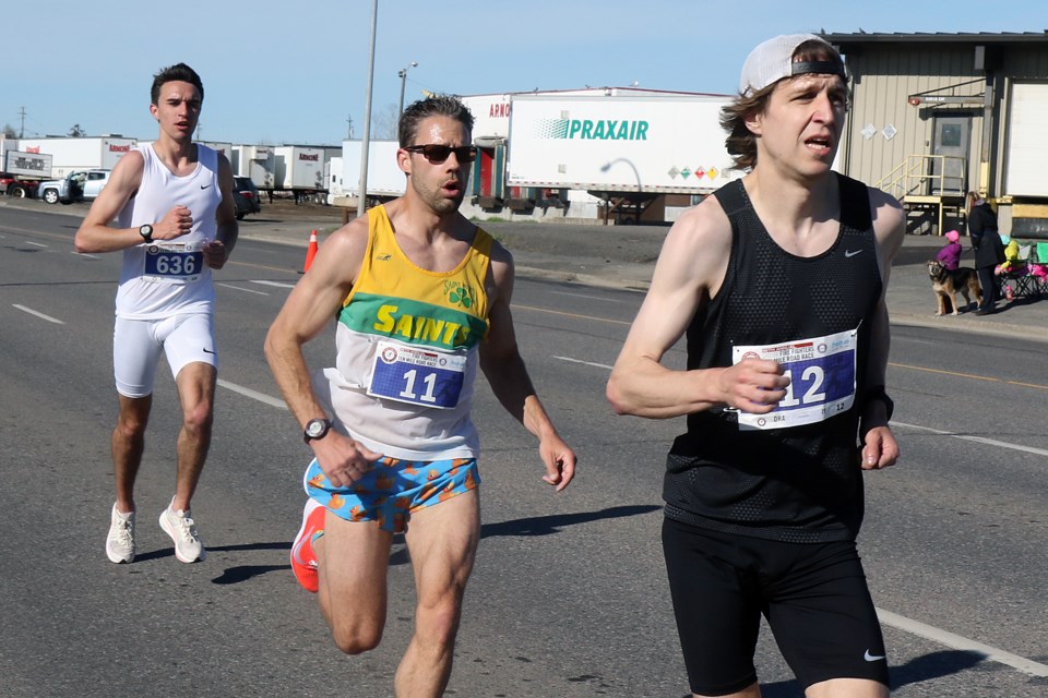 Winner Scott Behling (right) sets the pace on Monday, May 20, 2019 during the Fireghters Ten Mile Road race, with runner-up finisher Trevor Ziamk and third-place finisher Jordan McIntosh. (Leith Dunick, tbnewswatch.com)