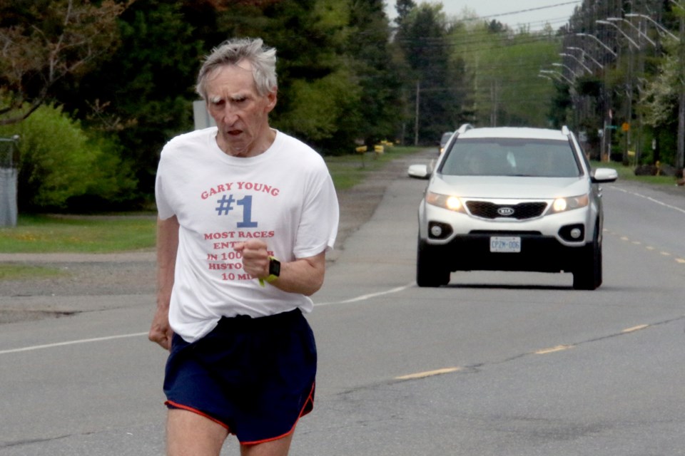 Gary Young finishes the Victoria Day 10-Mile Virtual Challenge on Monday, May 24, 2021 on Neebing Avenue in Thunder Bay. (Leith Dunick, tbnewswatch.com)