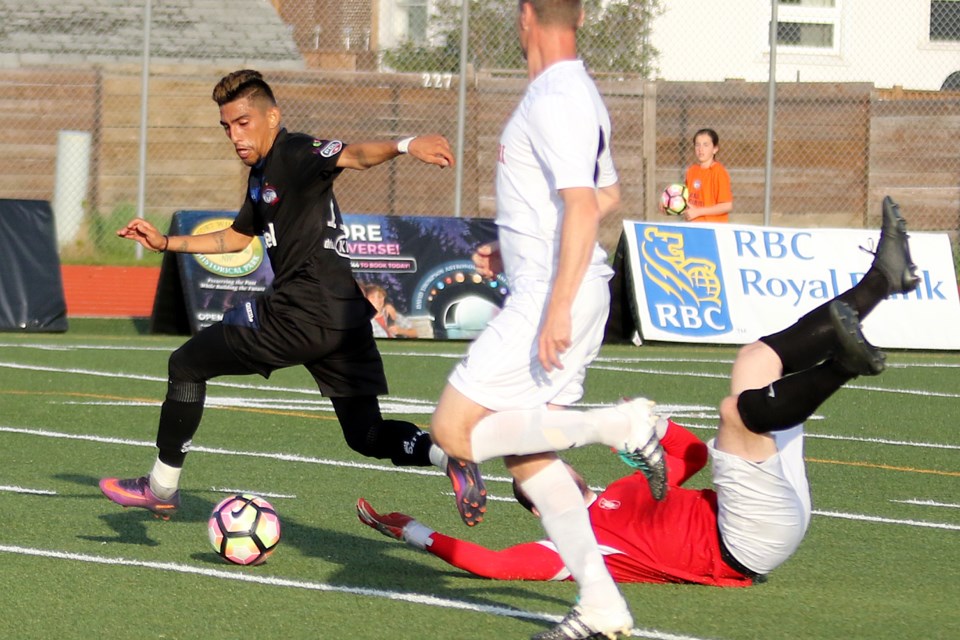 Chill midfielder German Alfaro bursts past fallen WInnipeg Lions goalie Sean Golden on Saturday, May 27, 2017 at Fort William Stadium (Leith Dunick, tbnewswatch.com). 