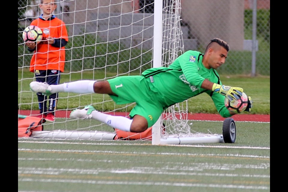 Thunder Bay Chill keeper David Elias makes a diving stop on Friday, June 23, 2017 against WSA Winnipeg (Leith Dunick, tbnewswatch.com). 