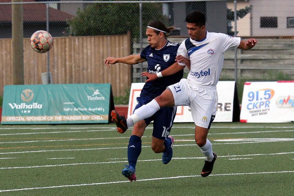 The Chill's Ammed Mohammed (right) battles Kaw Valley's Daniel Kozma on Wednesday, July 11, 2018 at Fort William Stadium. (Leith Dunick, tbnewswatch.com) 