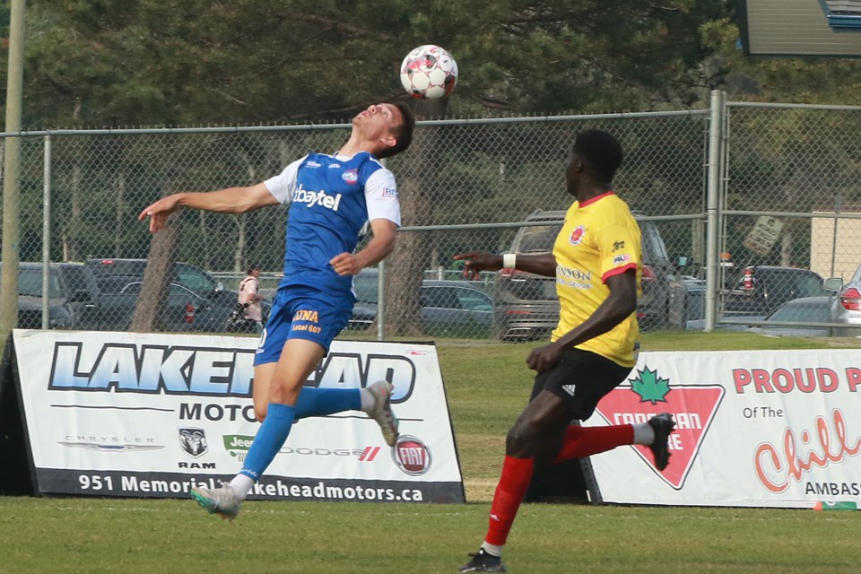 Thunder Bay's Jamie Wynne (left) looks to control the ball with his head on Friday, June 23, 2023 against RKC Third Coast defender Deng Deng Kur. (Leith Dunick, tbnewswatch.com)