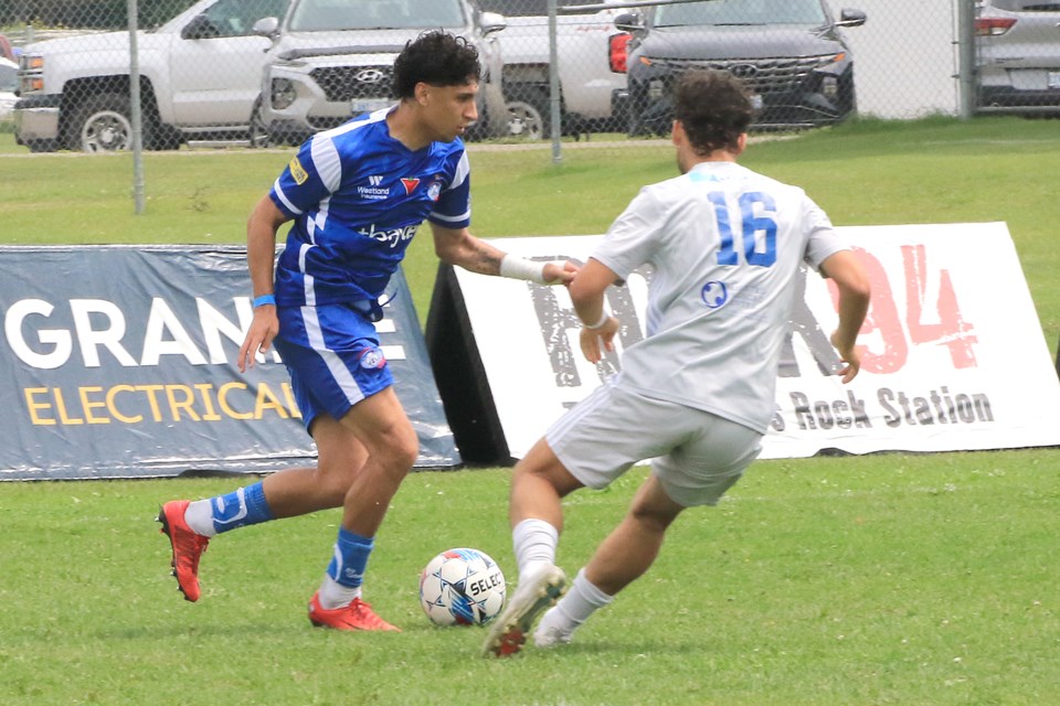 The Chill's Diego Reveco (left) looks to maneuver past Rochesrter's Jake Parish on Sunday, July 7, 2024. (Leith Dunick, tbnewswatch.com)