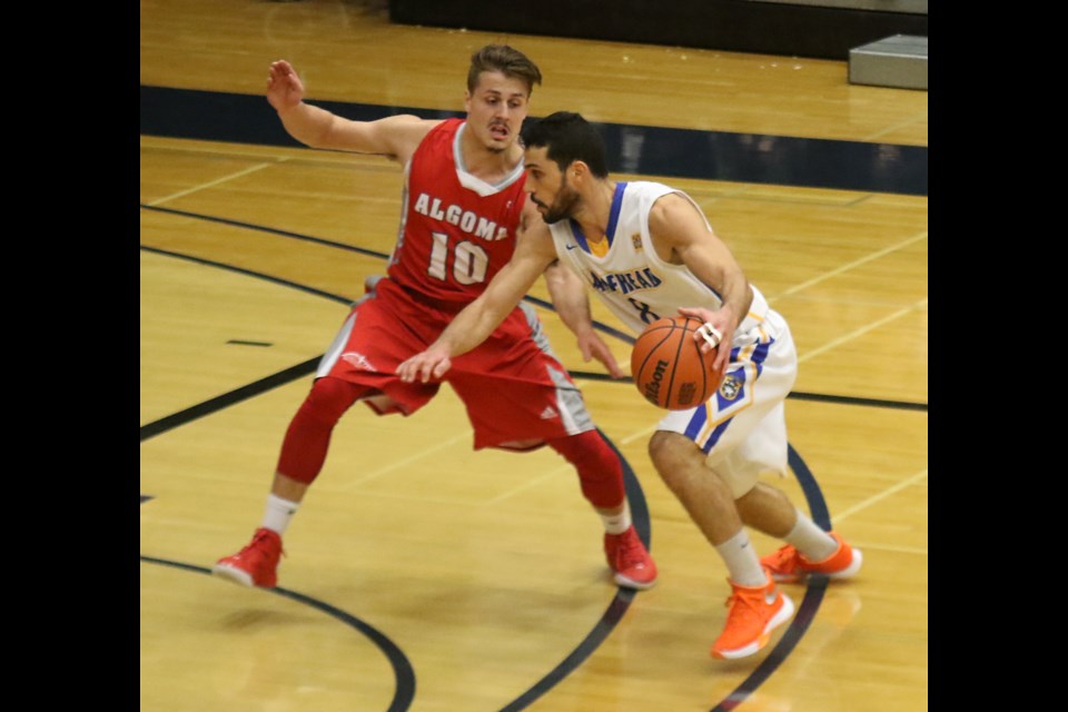 Lakehead's Mor Menashe (right) looks to move past Algoma's Sean Clendinning on Saturday, Nov. 5, 2016 at the Thunderdome (Leith Dunick, tbnewswatch.com). 