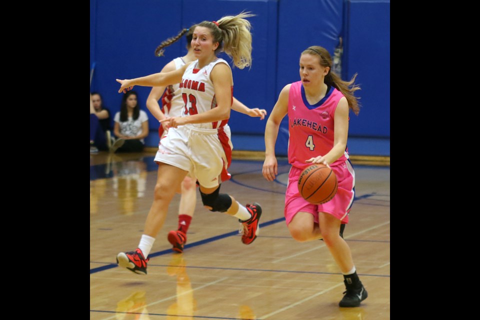 Lakehead's Rachel Webber (right) moves past Algoma's Karissa Kajorinne of Thunder Bay on Saturday, Nov. 5, 2016 at the Thunderdome. 