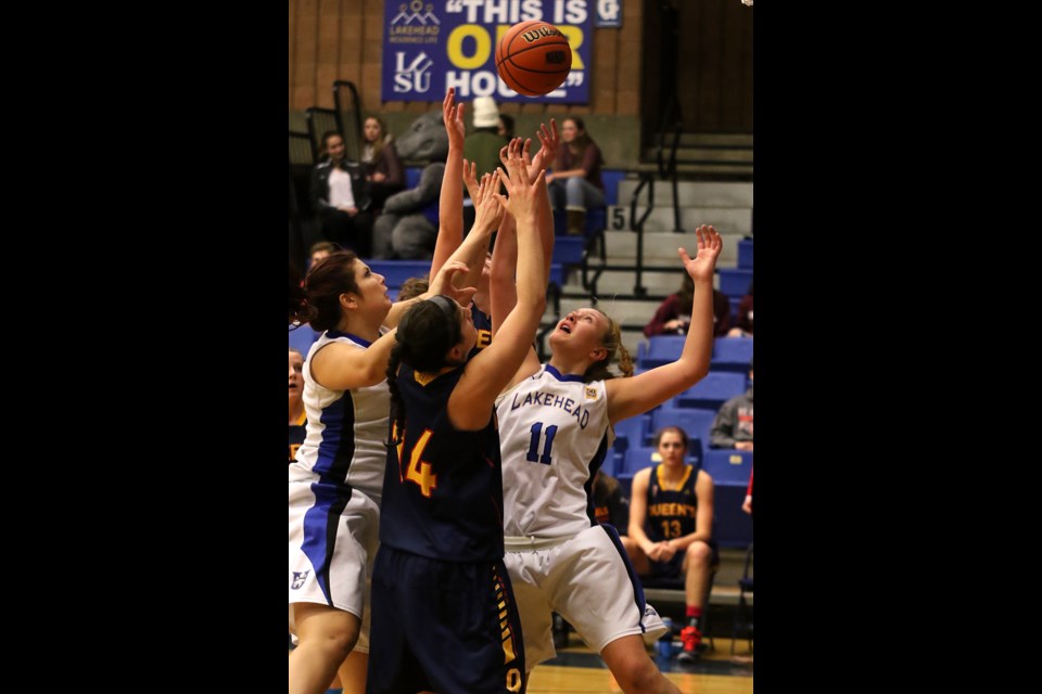 Lakehead's Lily Gruber-Schulz (right) battles Queen's Gaels' Andrea Priamo for the ball on Friday, Nov. 25, 2016 at the Thunderdome (Leith Dunick, tbnewswatch.com). 