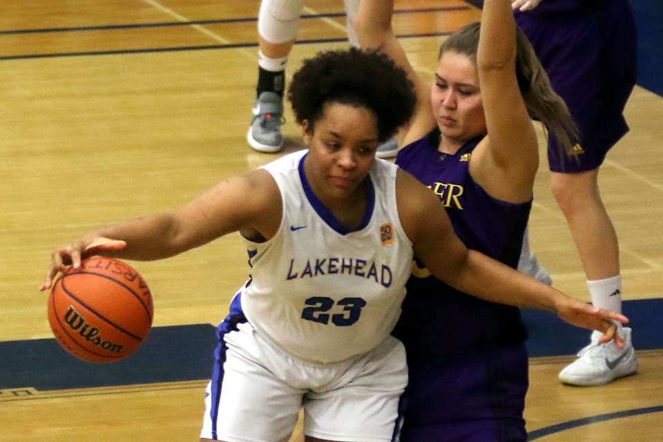 Lakehead's Leashja Grant (left) works her way around Laurier's Skye Johns on Wednesday, Feb. 21, 2018 at the C.J. Sanders Fieldhouse. (Leth Dunick, tbnewswatch.com)