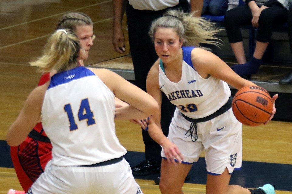 Lakehead's Karissa Kajorinne (right) uses teammate Charlotte Clifford as a pick against Brock's Kristin Gallant on Friday, Feb. 15, 2019 at the C.J. Sanders Fieldhouse. (Leith Dunick, tbnewswatch.com)