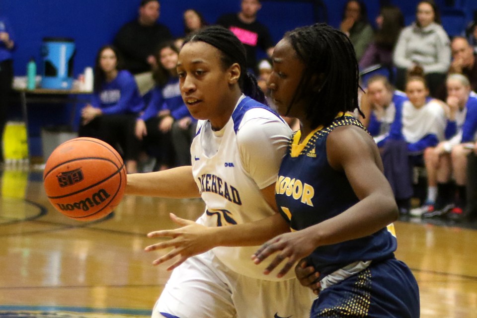 Lakehead's Tianna Warwick-Dawkins and Windsor's Eve Osamusali on Friday, Jan. 11, 2019 at the C.J. Sanders Fieldhouse. (Leith Dunick, tbnewswatch.com)