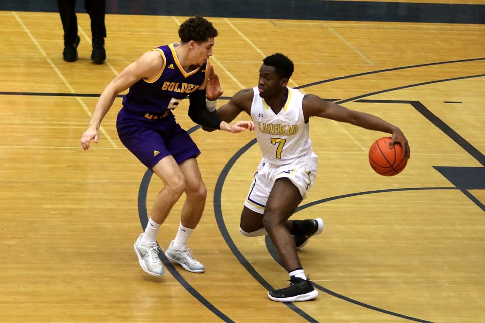 Lakehead;s Laoui Msambya (right) battles Laurier's Jackson Mayers on Saturday, Feb. 22, 2020. (Leith Dunick, tbnewswatch.com)