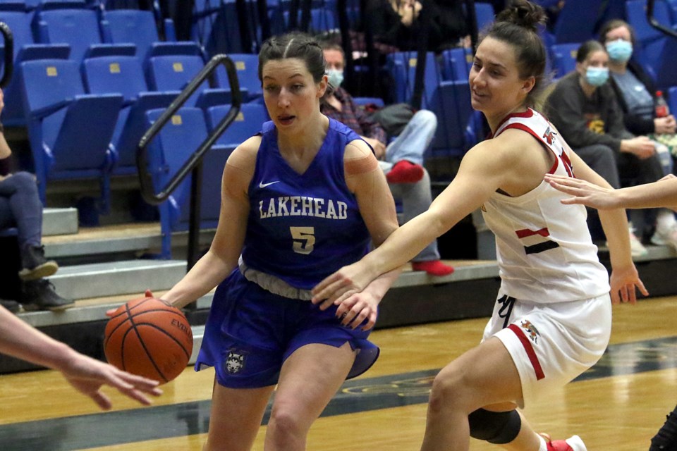 Lakehead's Ally Burke drives through traffic on Saturday, Feb. 12, 2022. (Leith Dunick, tbnewswatch.com)