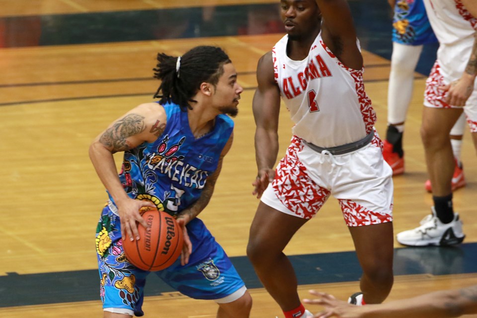 Lakehead's Alston Harris, wearing an Indigenous-inspired uniform, looks for space in the paint on Friday, Feb. 17, 2023 at the C.J. Sanders Fieldhouse against the visiting Algoma Thunderbirds. (Leith Dunicke, tbnewswatch.com)