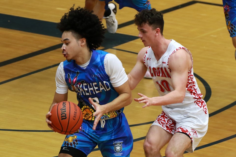 Lakehead's Seth Johnson (left) had eight points off the bench in the Thunderwolves 108-71 win over Riley Rathwell and Algoma at the C.J. Sanders Fieldhouse on Friday, Feb. 17, 2023. (Leith Dunick, tbnewswatch.com)