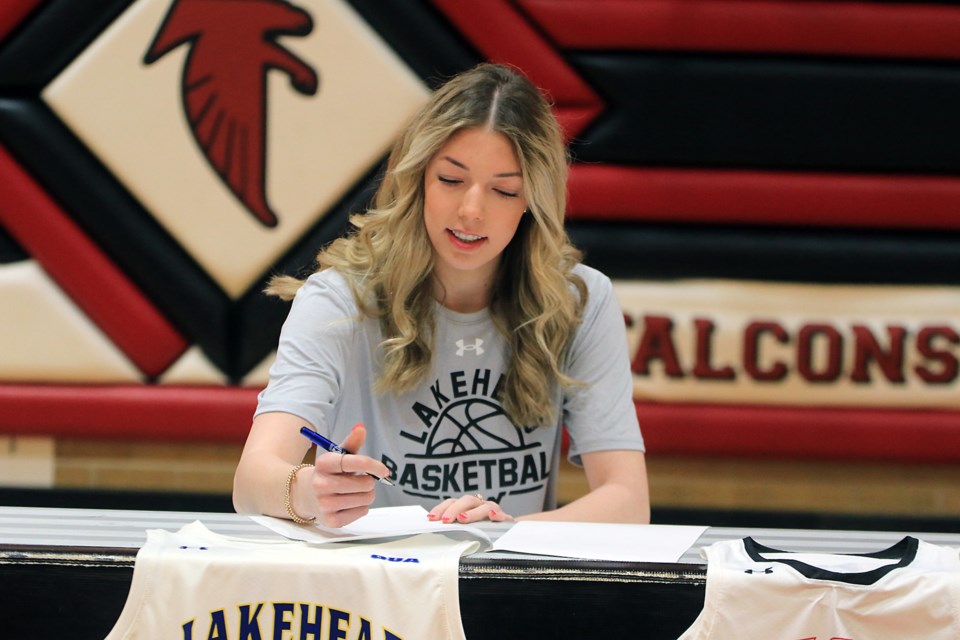 St. Ignatius' Kelsie Ellacott signs her commitment to Lakehead on Friday, March 7, 2025. (Leith Dunick, tbnewswatch.com)