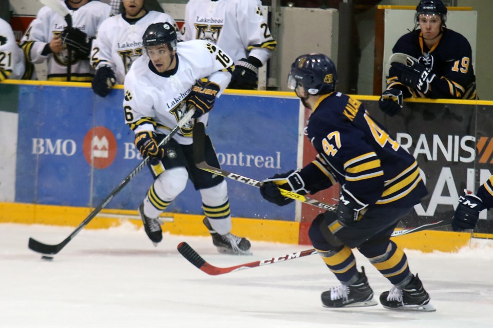 Thunderwolves forward Dylan Butler (16) moves the puck against Lethbridge centre Arty Kalashnikov on Friday, Sept. 30, 2016 at Fort William Gardens (Leith Dunick, tbnewswatch.com). 