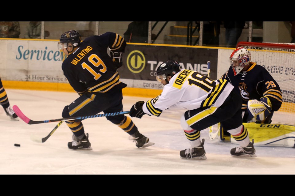 Lakehead's David Quesnele (right) chases down Lethbridge centre Justin Valentino on Friday, Oct. 1, 2016 at Fort William Gardens (Leith Dunick, tbnewswatch.com). 