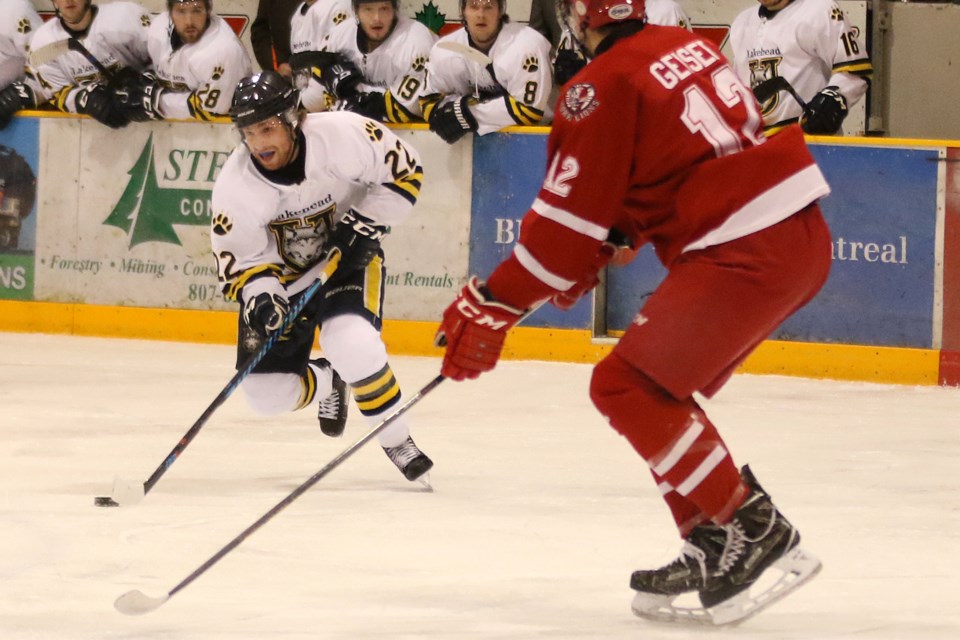 Lakehead's Brennen Dubchak (left) works his way past York's Nicholas Geiser on Wednesday, Feb. 15, 2017 at Fort William Gardens (Leith Dunick, tbnewswatch.com)