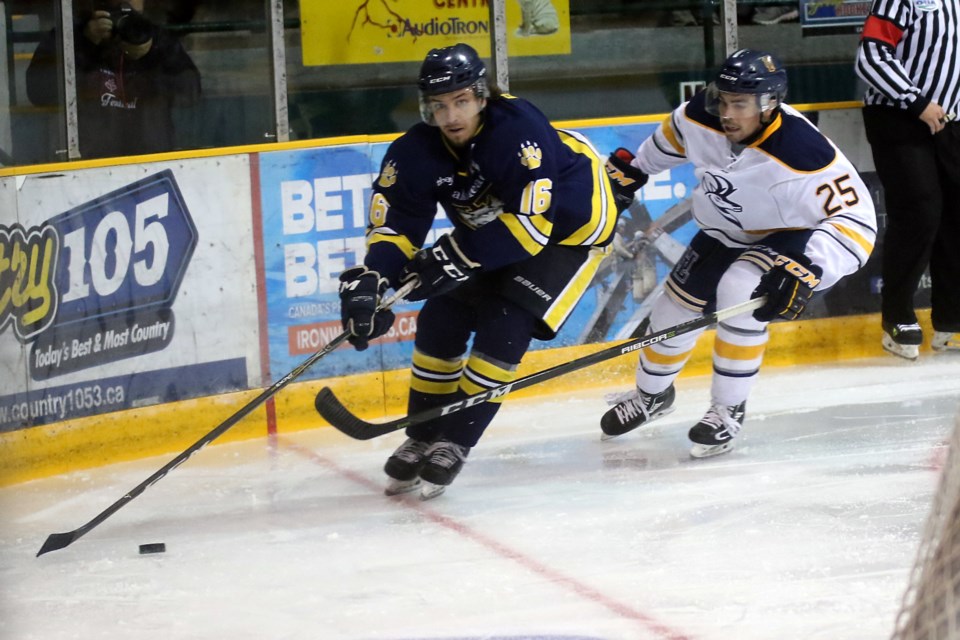 Lakehead's Dylan Butler (left) tries to escape the clutches of Lethbridge's Blake Orban on Friday, Sept. 21, 2018 at Fort William Gardens. (Leith Dunick, tbnewswatch.com)
