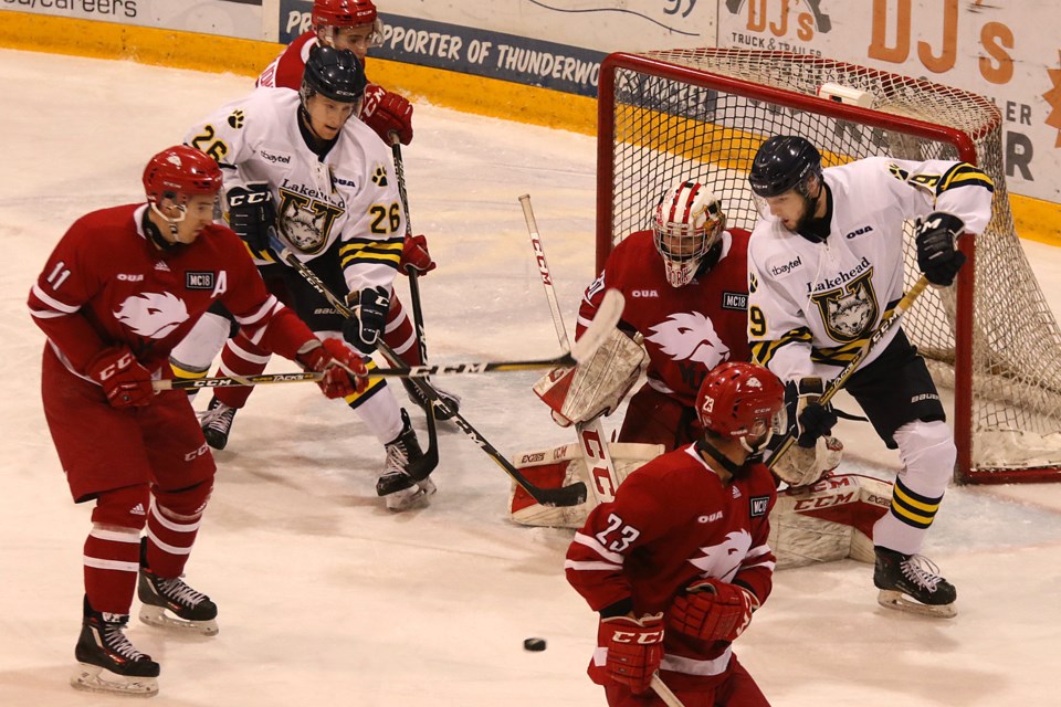 Scott Gall (26) and Tomas Soustal (19) battle in front of York goalie Mack Shields on Friday, Nov. 9, 2018 against the York Lions at Fort William Gardens. (Leith Dunick, tbnewswatch.com)