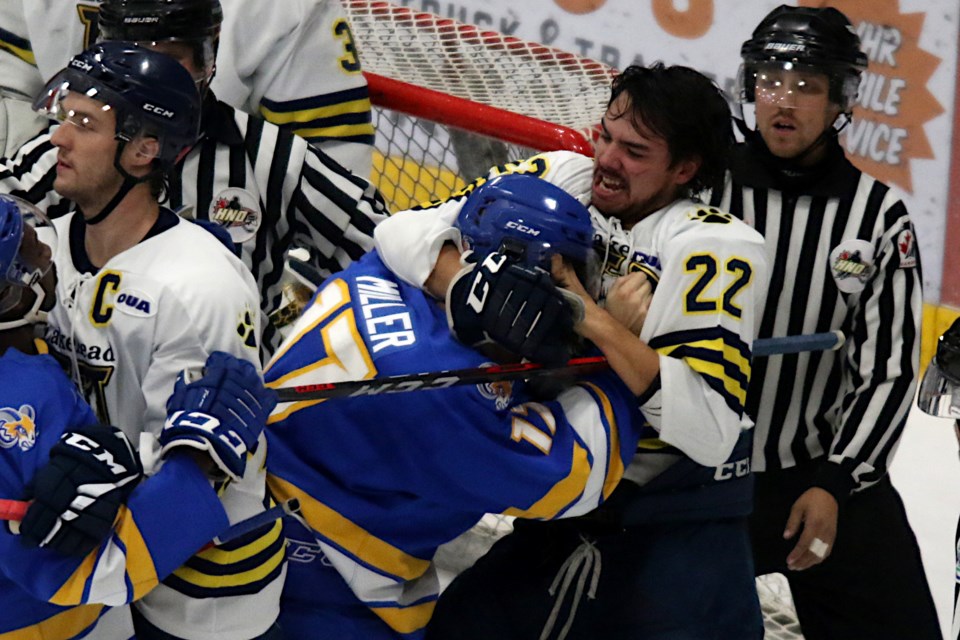 Lakehead's Troy Williams fights Ryerson's David Miller on Thursday, Nov. 11, 2021. (Leith Dunick, tbnewswatch.com)