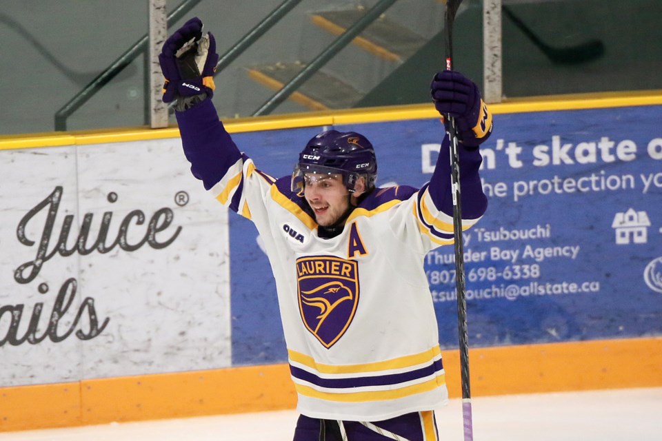 Laurier's Patrick Brown celebrates his third goal of the weekend on Saturday, Jan. 13, 2024 at Fort William Gardens, leading his team to a 3-1 win over the Lakehead Thunderwolves. (Leith Dunick, tbnewswatch.com)