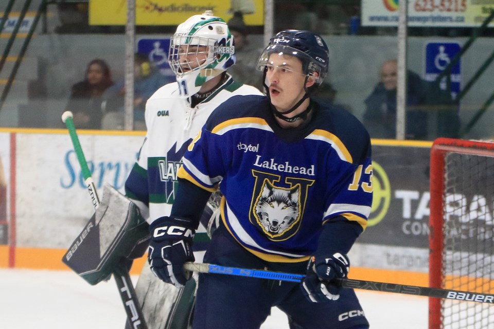 Lakehead's Griffen Fox sets up shop in front of Nipissing goaltender Zach Roy on Friday, Feb. 9, 2024. (Leith Dunick, tbnewswatch.com)