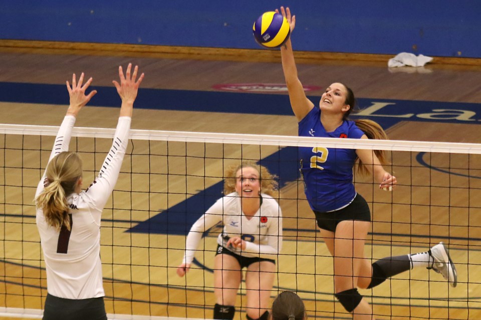 Lakehead's Kailan Robinson (2) spikes the ball over the net on Friday, Nov. 11, 2016 against the McMaster Marauders at the Thunderdome (Leith Dunick, tbnewswatch.com). 