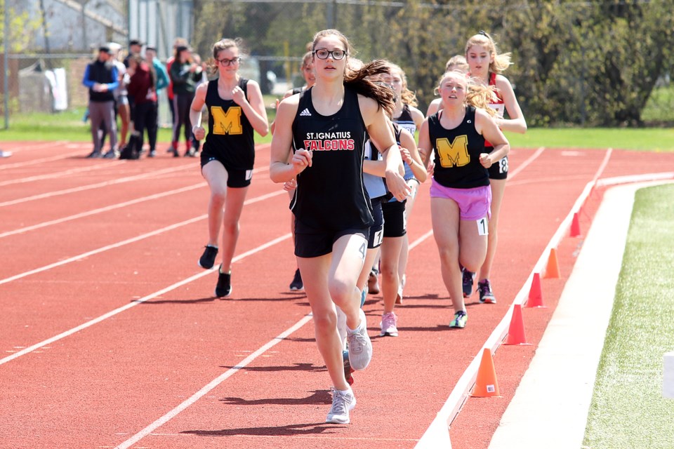 St. Ignatius Falcons runner Jamie Puhalski led the midget girls' 1,500-metre race from start to finish at the SSSAA track and field championships at Legion Track on Tuesday, May 28, 2019. (Leith Dunick, tbnewswatch.com)