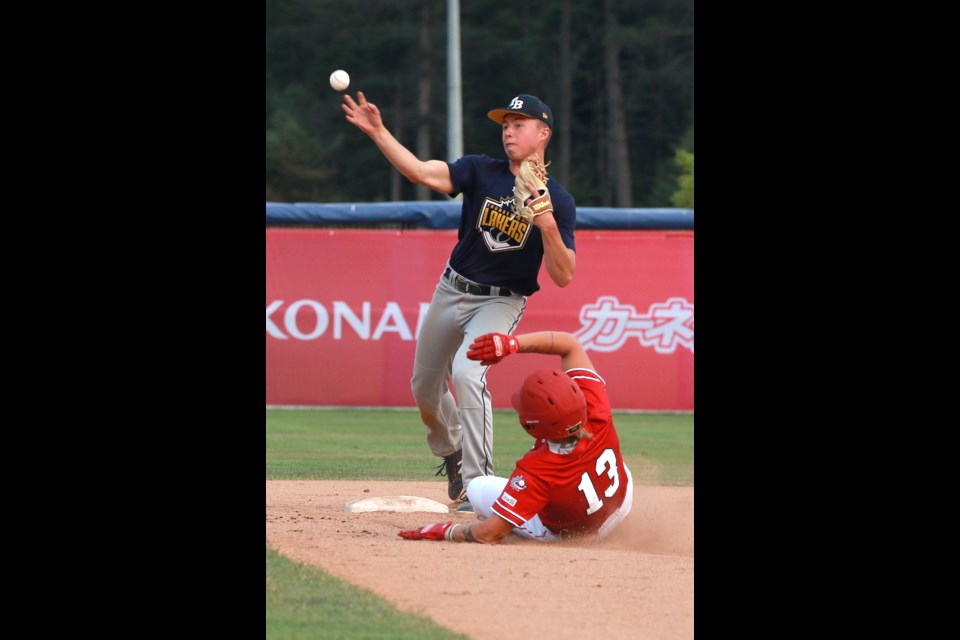 Team Canada's Zoe Hicks tries to break up the double-play attempt, sliding into second where the Lakers Nolan Desando is ready to make the throw to first, on Sunday, Aug. 6, 2023, in a warm-up for the 2023 Pool A WBSC Women's Baseball World Cup qualifier. (Leith Dunick, tbnewswatch.com)