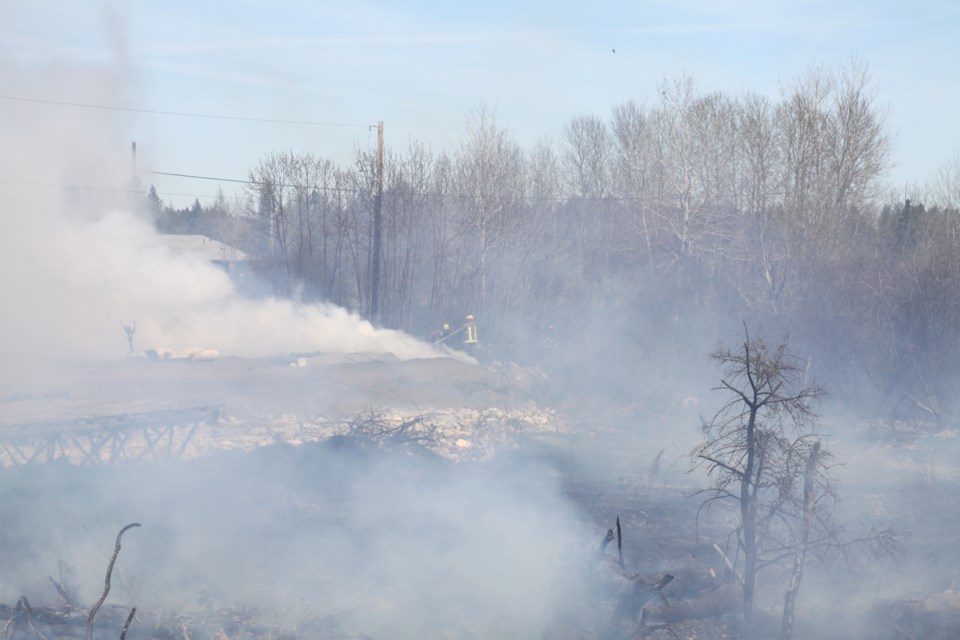 Fire crews work to extinguish a fire behind Sarjeant Propane on West Arthur Street on May 21, 2025. 