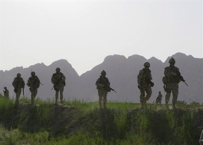 Canadian soldiers patrol an area in the Dand district of southern Afghanistan on Sunday, June 7, 2009. (Colin Perkel, The Canadian Press)