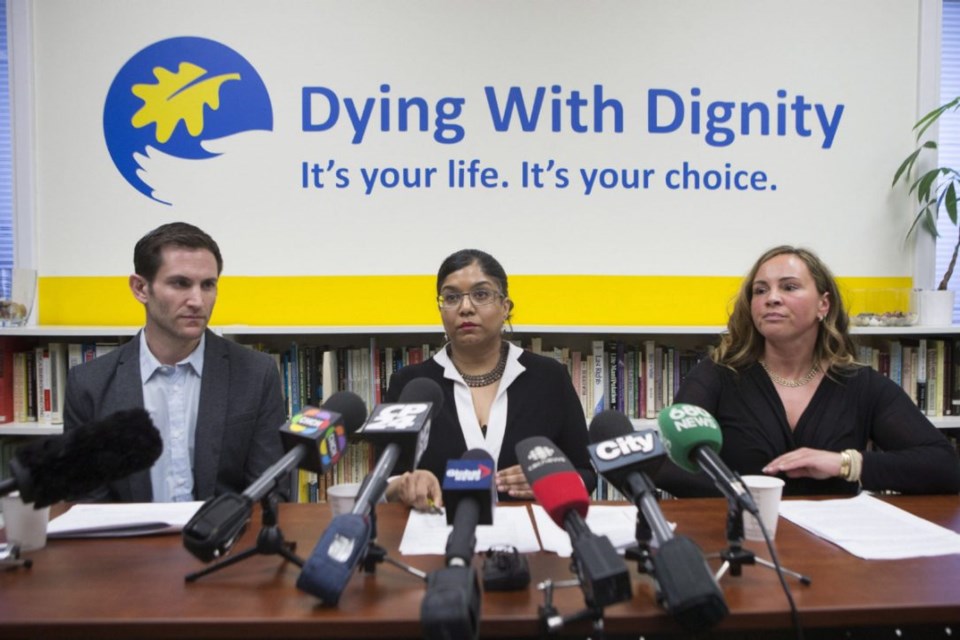 Dying with Dignity Canada's CEO Shanaaz Gokool, centre, says it’s impossible to discern clearly what’s happening across the country with assisted death, or how the legislation is being applied.  (Chris Young / The Canadian Press)