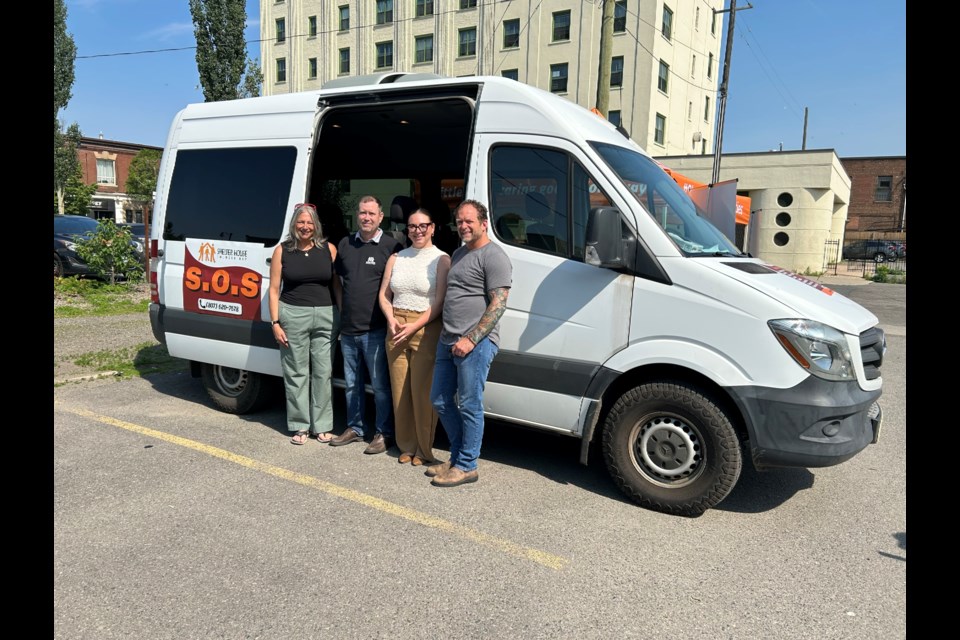 The Lakehead Social Planning Council's Bonnie Krysowaty, Shelter House's Brendan Carlin, the Thunder Bay Indigenous Friendship Centre's Annika Gregg and Thunder Bay DSSAB chair Brian Hamilton help relaunch the SOS program on July 3, 2025. 