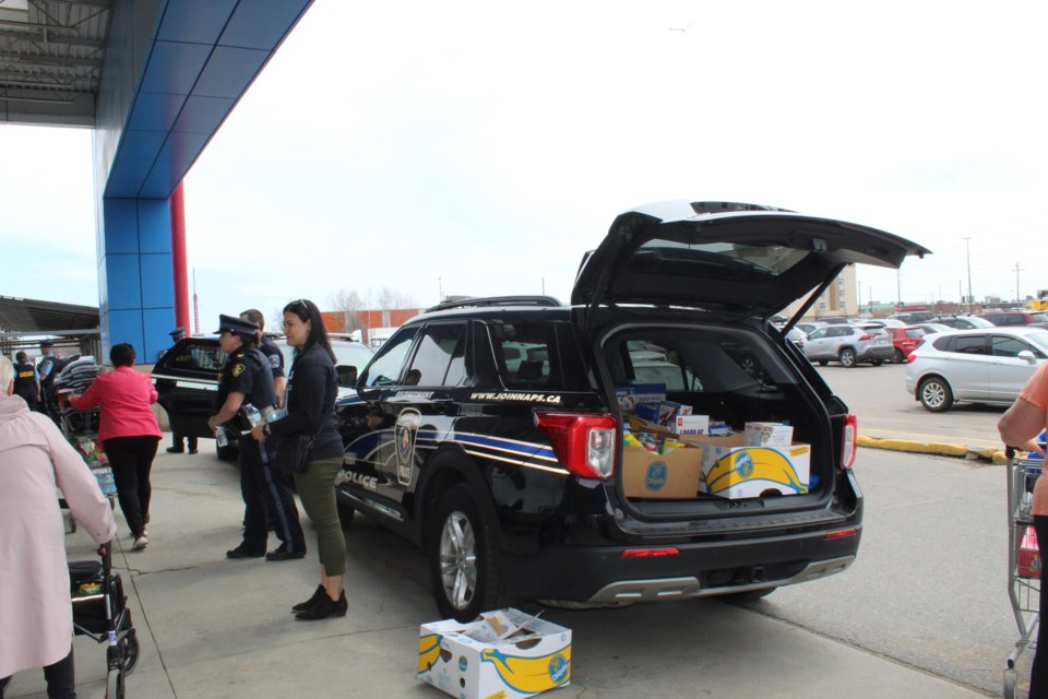 A police cruiser is loaded up with donations for the RFDA outside of Superstore on May 16, 2025. 