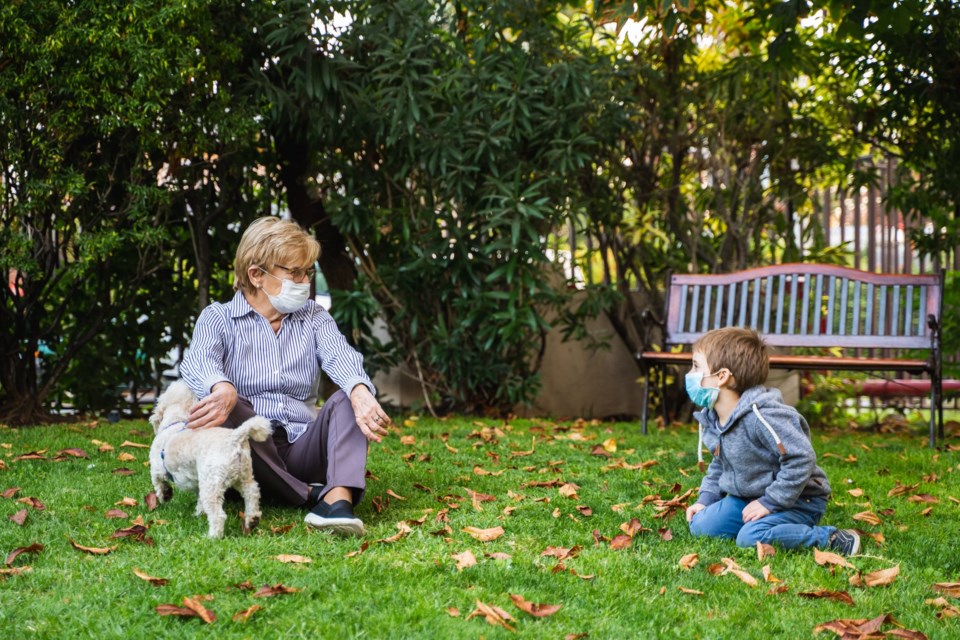 Grandmother,And,Little,Kid,Playing,With,A,Smartphone,In,The