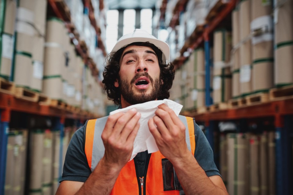 Young,Caucasian,Warehouse,Supervisor,Sneezing,While,Feeling,Sick,Of,Cold