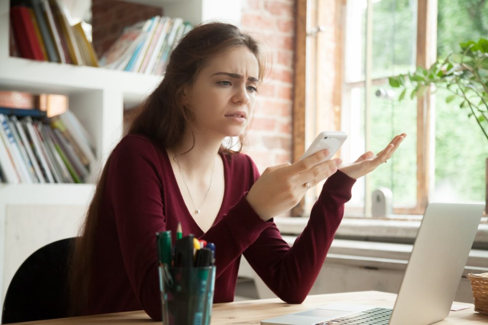 Frustrated,Woman,Having,Problem,With,Not,Working,Smart,Phone,Sitting