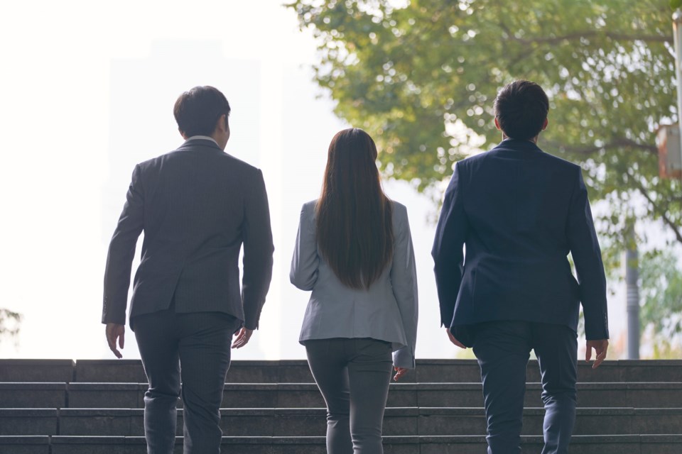 Rear,View,Of,Three,Young,Successful,Asian,Business,People,Ascending