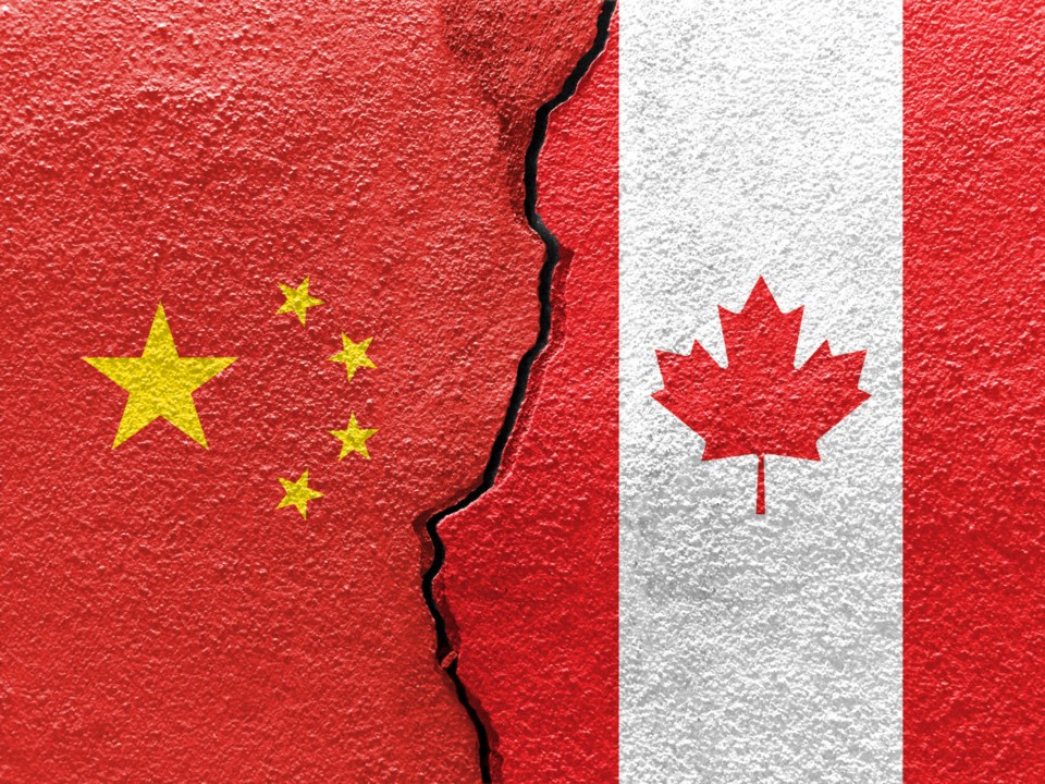 China,And,Canada,Flags,On,Cracked,Concrete,(international,Conflict,Concept)