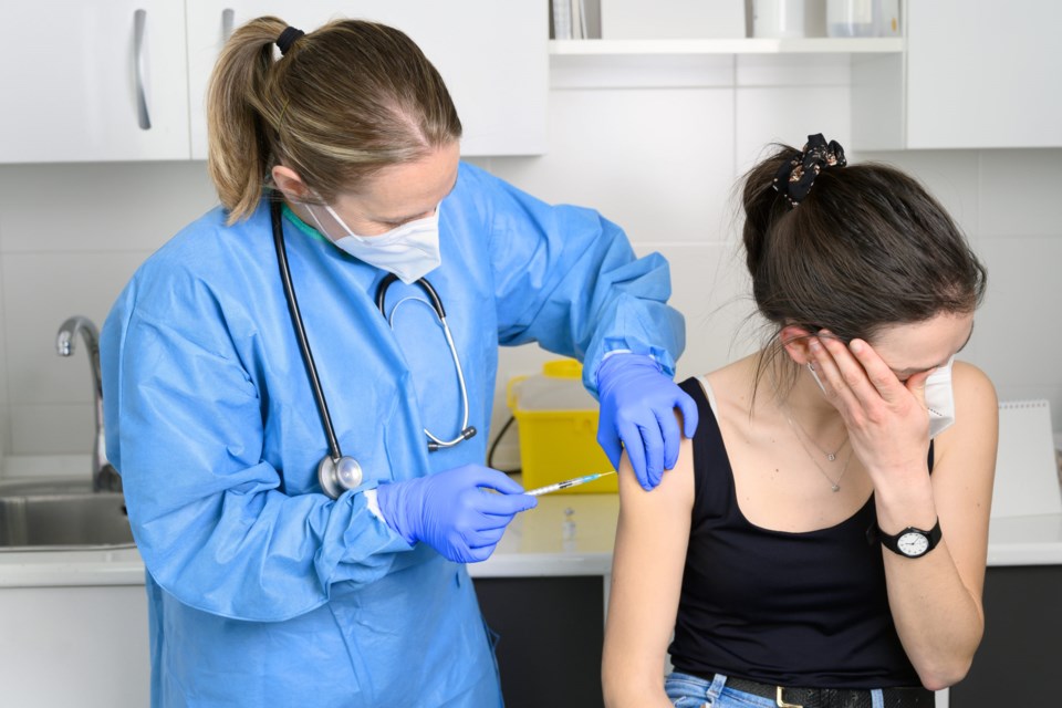 Young,Woman,In,Face,Mask,Scared,Of,Coronavirus,Vaccine,,Not