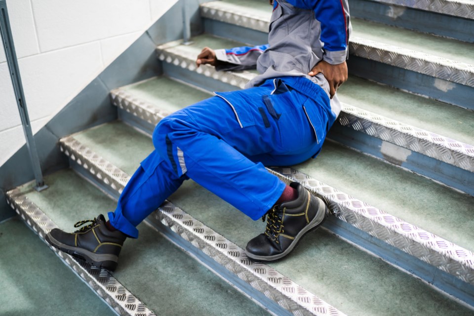 Worker,Man,Lying,On,Staircase,After,Slip,And,Fall,Accident