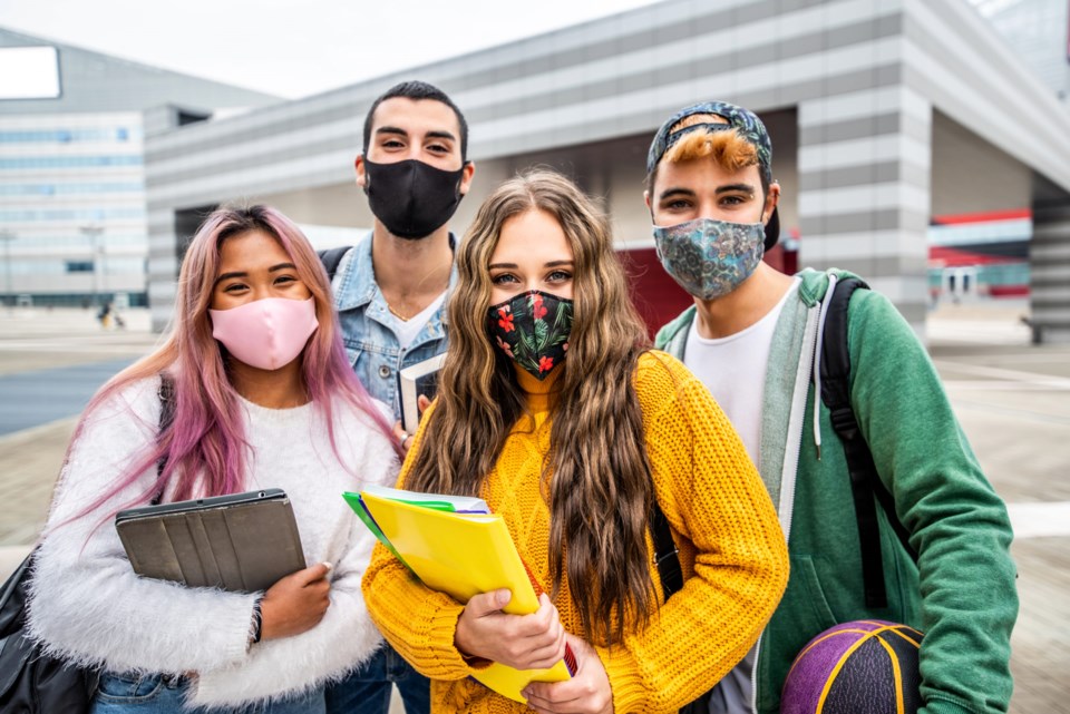 Portrait,Of,A,Group,Of,Students,Covered,By,Face,Masks.