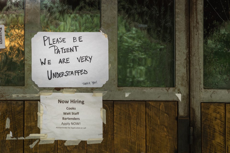 Rustic,Sign,In,Restaurant,Window,During,Time,Of,Covid,Stating