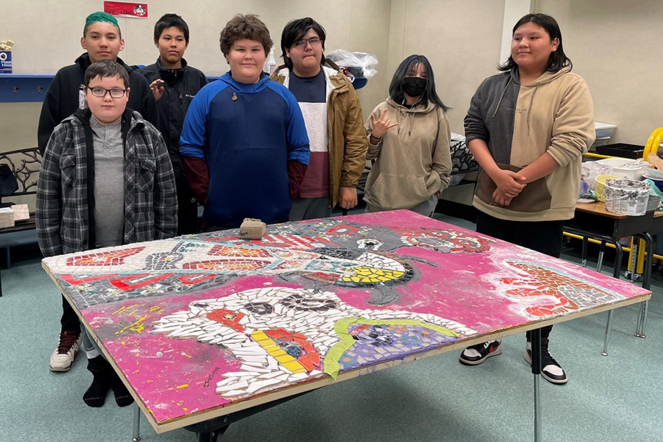 Wapanohk community School students with their school’s in-progress glass mosaic mural.