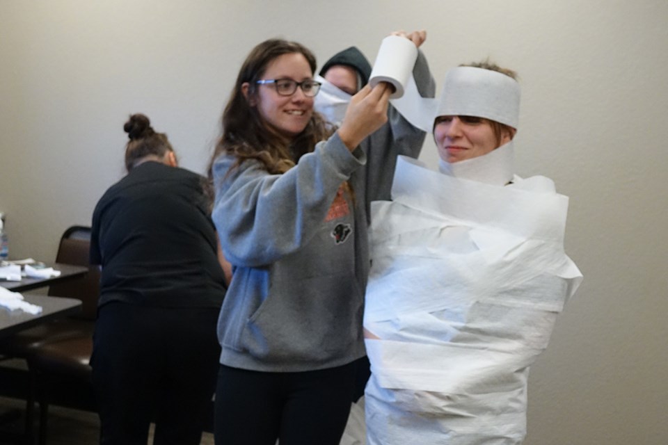 Quality Inn & Suites Thompson housekeepers wrapped their partners in toilet paper during a mummy-making contest on Sept. 14
